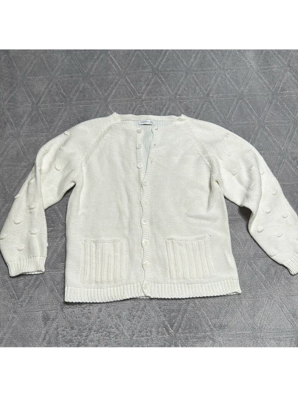 White knitted cartigan with Pom Pom sleeves